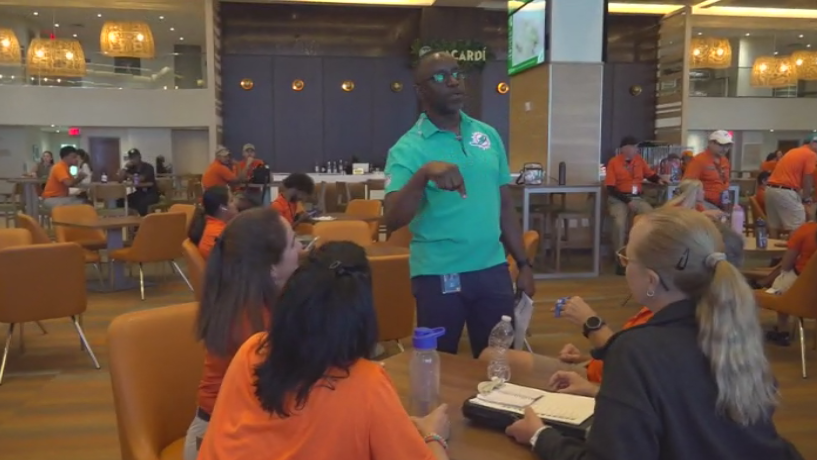 Miami Dade College professor finds his passion with side job at Hard Rock Stadium — CBS Miami, Jupiter Arts news